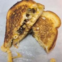 Meltdown Grilled Cheese · Thick Sourdough bread with garlic aioli, Tillamook Cheddar cheese, smoked brisket and smoked...