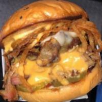 Big Bumblebeez Burger · Smoked Pulled Pork, drizzled with melted nacho cheese, 1/3 pound burger patty, Tillamook Che...