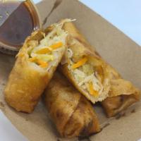 Veggie Lumpia (3) · Hand rolled Filipino Eggrolls, filled with cabbage and carrots, served with a side of Hunny ...