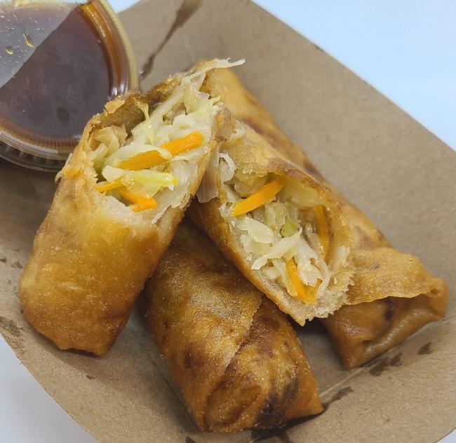 Veggie Lumpia (3) · Hand rolled Filipino Eggrolls, filled with cabbage and carrots, served with a side of Hunny Beez Sauce.