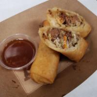 Smoked Brisket Lumpia (2) · Hand rolled Filipino Eggrolls, filled with Smoked brisket & cabbage , served with a side of ...