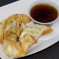 Fried Pot Stickers (6) · Deep fried dumplings stuffed with chicken & vegetables & served with a side of Hunny Beez sa...