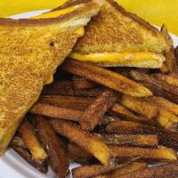 Kids Grilled Cheese · Texas Toast and melted American Cheese, served with a side of fresh cut fries.