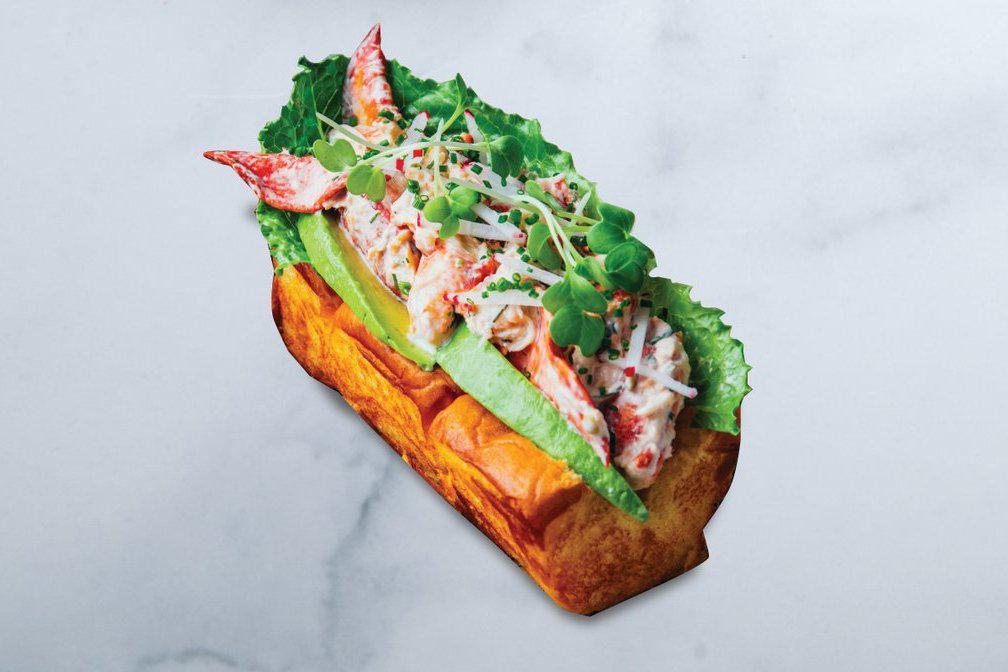 Lobster Roll · tarragon-dill lobster salad, avocado, radish, romaine, chives, butter-toasted King’s Hawaiian roll, with sesame slaw, choice of fries