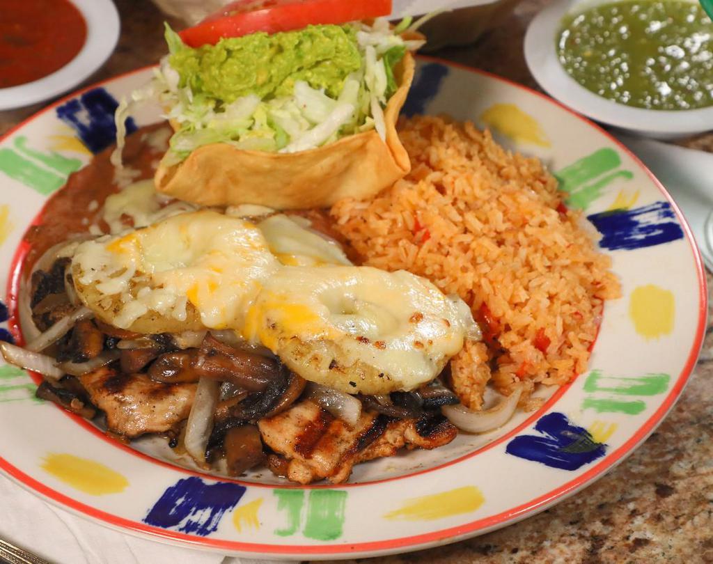 Hawaiian Chicken · 8 oz. Grilled chicken breast topped with grilled onions, mushrooms, 2 pineapple slices and slices of melted American cheese. Served with Mexican rice and your choice of refried beans or guacamole salad.