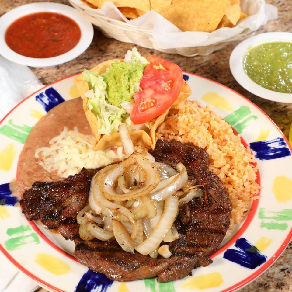 MP Beef Steak a la Tampiquena · 8 oz. ribeye steak topped with grilled onions. Served with Mexican rice, refried beans and guacamole salad. Choice of flour or corn tortillas.