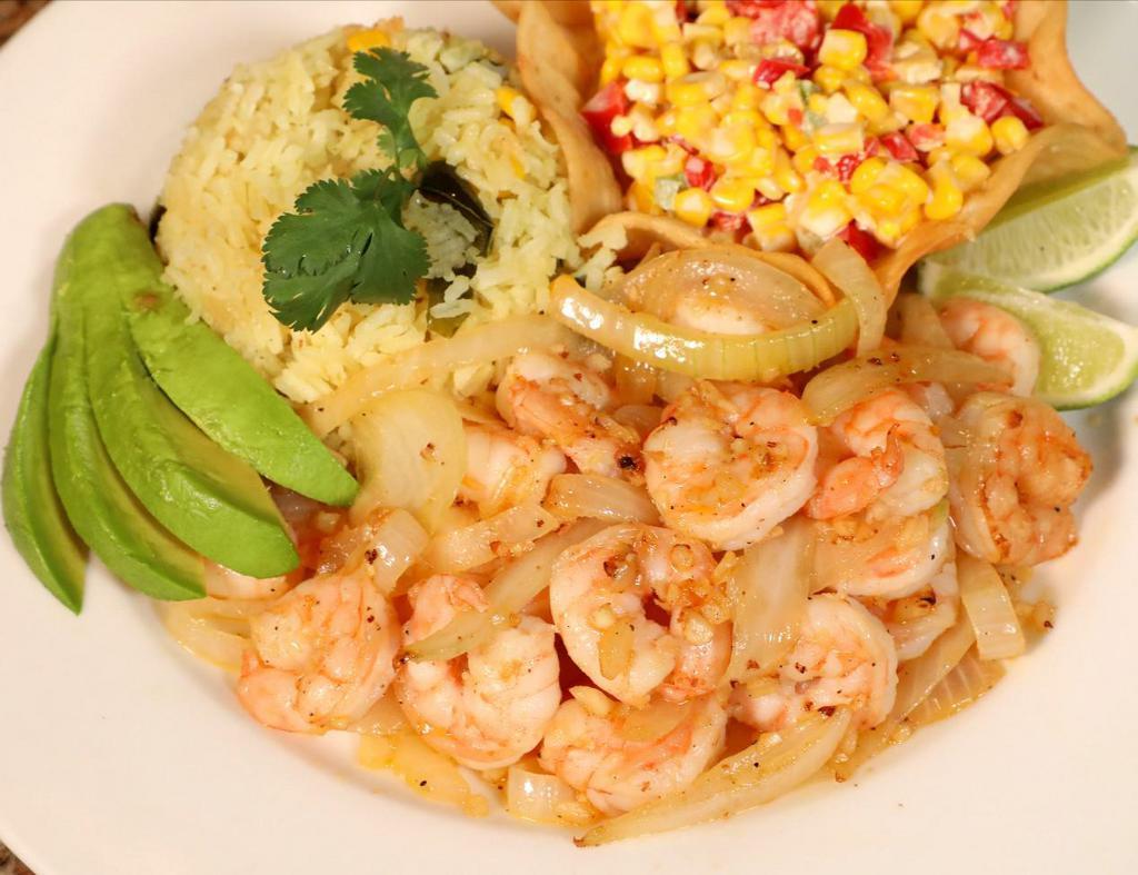 Camarones al Ajillo · 14 grilled shrimp sauteed with fresh garlic and onions. Served with white rice, corn salad and avocado slices.