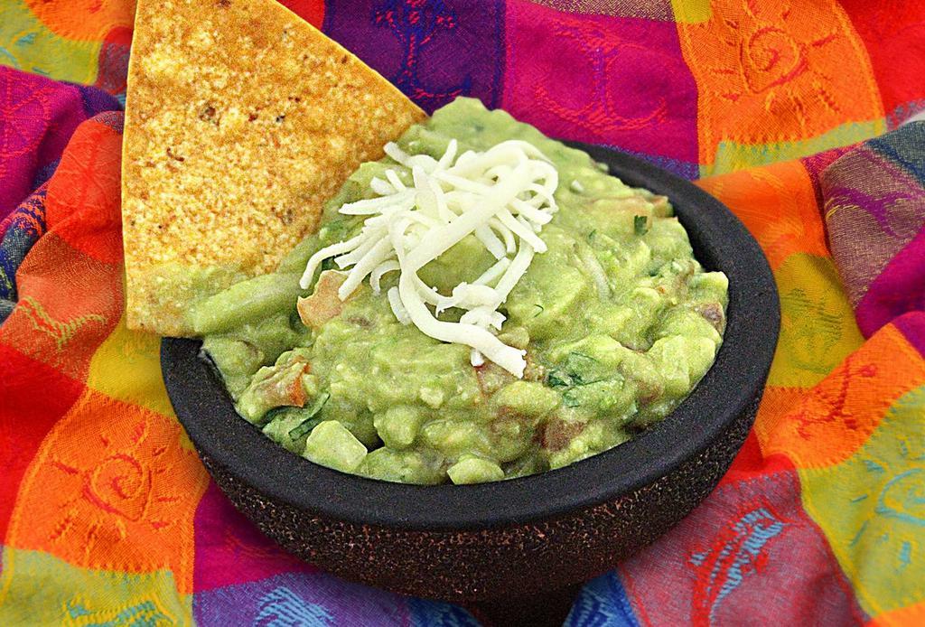 Guacamole with Chips · Traditional guacamole made with fresh avocado, onion, tomato, cilantro and lime juice.