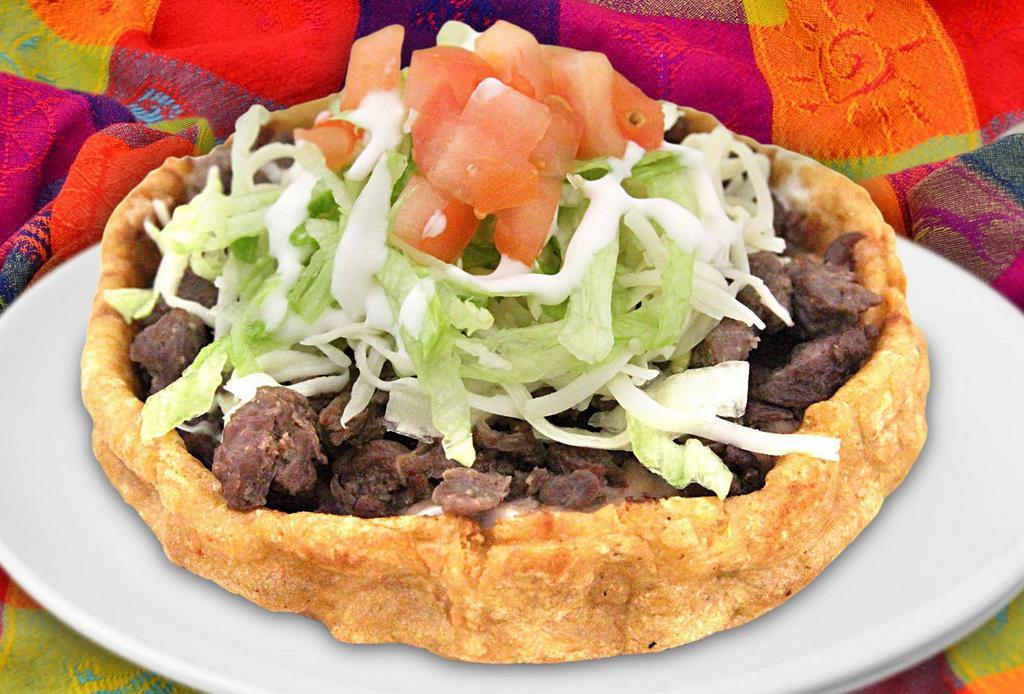Sope · Thick deep-fried corn dough base with your choice of meat topped with beans,
lettuce, tomato, cheese and sour cream.