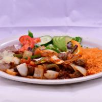 Bistec a la Mexicana Dinner · Ribeye steak cooked with onion, tomato and jalapenos with red sauce.
