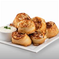 Cheezee Bacon Rolls  · Rich and buttery bacon rolls made with our creamy signature white garlic sauce and filled wi...