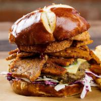 BBQ Brisket Burger · Brisket-style sliced seitan, a made-with-plants burger patty, crispy fried onion rings, smok...