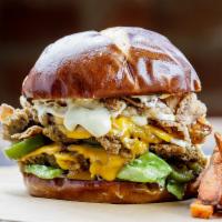 Poppin' Jalapeno Burger  · 2 made-with-plants burger patties covered in cheddar cheese. With pickled jalapeños, crispy ...