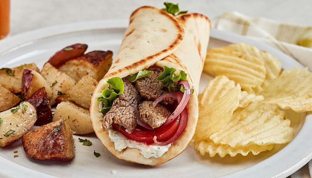 Grilled Beef Tender Gyro · Taziki sauce, tomatoes, mixed lettuce and grilled onions.