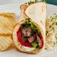 Grilled Lamb Gyro · Taziki sauce, tomatoes, mixed lettuce, and grilled onions. 