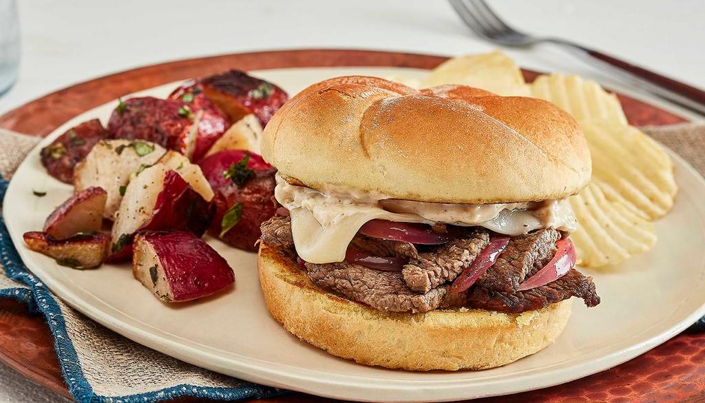 Grilled Beef Sandwich · With grilled onions, melted Swiss, and horseradish sauce on a kaiser bun.