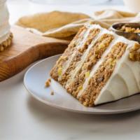 Hummingbird Cake · pineapple- banana cake layers filled with vanilla orange cream cheese frosting, fresh pineap...