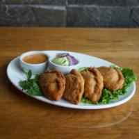 Thai Curry Puff · Thai traditional puff appetizers with chicken and curry powder.