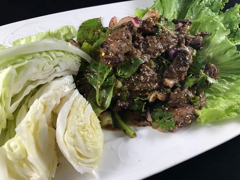 Grilled Meat Salad · Grilled sliced beef mixed in lime-based dressing with rice powder, chili powder, cilantro, shallot, fresh basil leaves