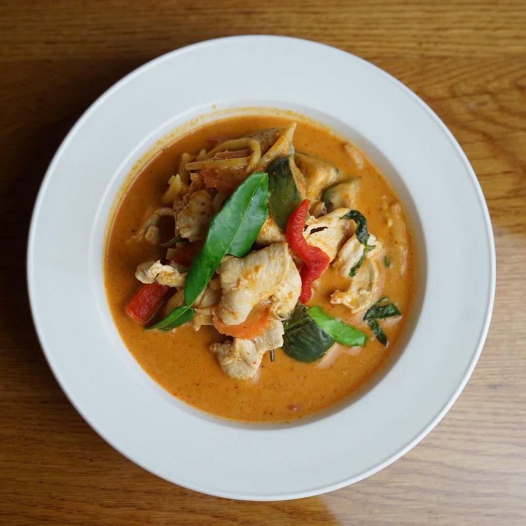 Red Curry · Red curry with Thai eggplant, bamboo shoot, red bell peppers, kaffir lime leaves. Choice of protein.