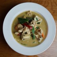 Green Curry · Medium spicy Green curry with Thai eggplant, bamboo shoot, red bell peppers, kaffir lime lea...