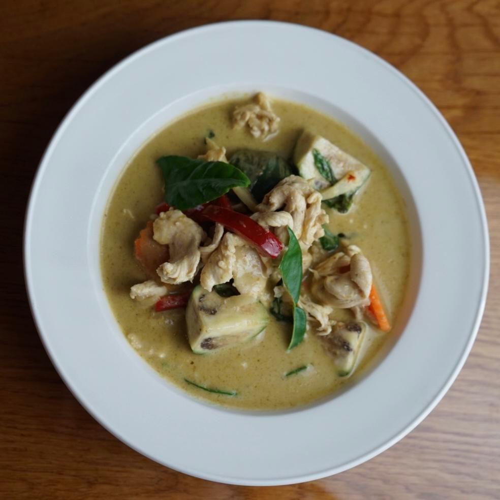 Green Curry · Medium spicy Green curry with Thai eggplant, bamboo shoot, red bell peppers, kaffir lime leaves.