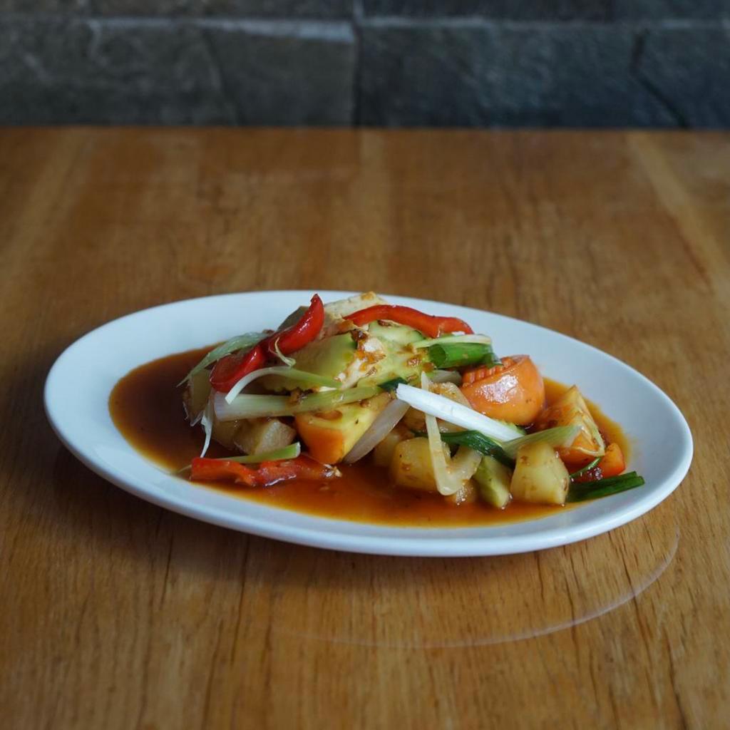 Sweet and Sour Tofu  · Tofu stir-fried in Thai style sweet and sour sauce with assorted vegetables and pineapple.