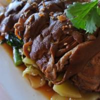 Stewed Pork Leg · Well stewed pork leg in 5 spices soup, served with sides of green mustard,
Chinese broccoli,...