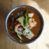Fried Egg Tamarind Soup · Fried egg with acacia and prawns in tamarind and chili broth.