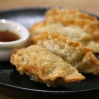 PORK DUMPLINGS · Fried dumplings fried with seasoned ground pork and vegetables.