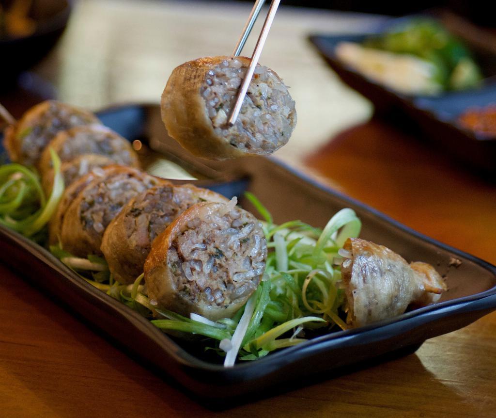 DAECHANG SUNDAE · Stuffed large intestine with seasoned beef, pork, onion, glass noodles, tofu, cabbage and chives.