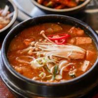 DOENJANG JJIGAE · Soybean paste stew with pork, tofu and vegetables.