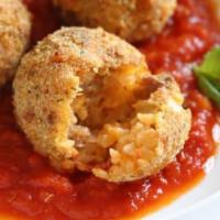 Traditional Rice Balls Parmigiana · A mix of beef and rice, served with marinara sauce