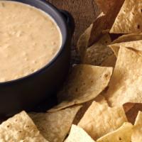 Chips & Queso · Our signature 3-Cheese Queso, served with freshly fried in-house tortilla chips. [Cal 940]