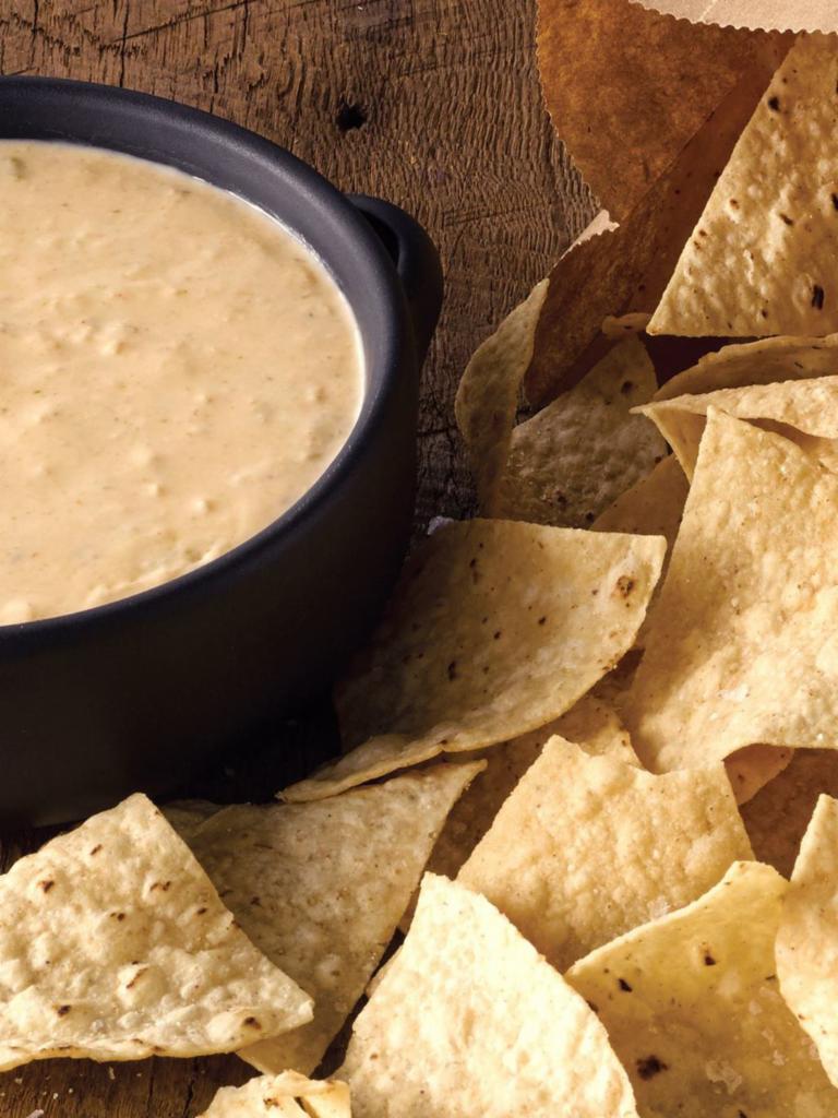 Chips & Queso · Our signature 3-Cheese Queso, served with freshly fried in-house tortilla chips. [Cal 940]