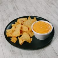 Chips and Queso · Crunchy Tortilla Chips and 8oz Spicy Nacho Cheese.