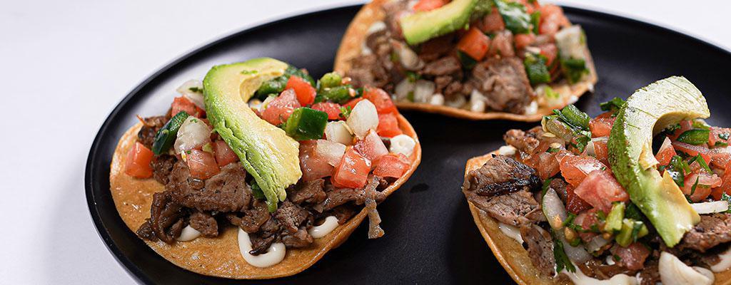 Tostadas · Three Crispy Open Corn Tortillas, with Mayo, Choice of any Meat, Pico de 
Gallo, and Avocado Slices.