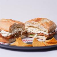 Milanesa Torta · A Mexican Style Sandwich with Mayo, Avocado, Tomato, Pickled Jalapenos, Breaded Pork Chops, ...