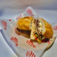 Torta de Steak · A Mexican Style Sandwich with Mayo, Avocado, Tomato, Pickled Jalapenos, Grilled Steak, and O...