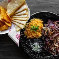 Steak and Onions Plate · Steak and Grilled Onions Served with Rice, Beans. and Tortillas.