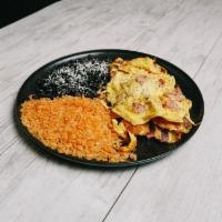 Huevos Plate · Choice of (Scrambled or Sunny  Side) Served with Rice, Beans, and Tortillas.