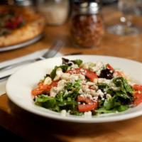 Wild Greens Salad · Wild greens, tomato, Gorgonzola, cashew and raspberry vinaigrette.