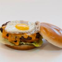 2. Yummy Egg Burger · Beef patty, lettuce, tomato, American cheese, spicy yummy, and egg.