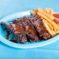 1. Yummy Beef Ribs · Slow cooked baby beef ribs with french fries and yummy BBQ sauce.