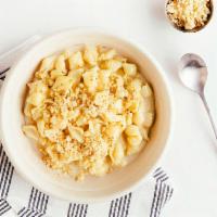 Classic Mac · 670 Calories - creamy white cheddar sauce on shells and pie crust topping