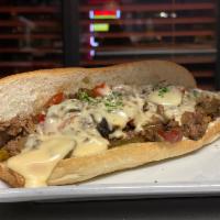 Cheesesteak Deluxe · Grilled onions, mushrooms, sweet peppers, lettuce, tomato, mayo and provolone cheese.