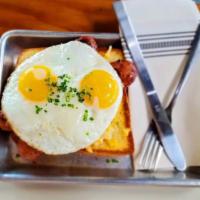 Always Sunny · Grilled sausage, fontina, gouda, cheddar and Oaxaca topped with sunny-side-up eggs over brio...