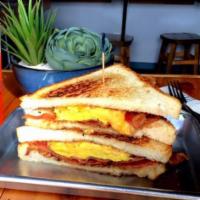 Breakfast Bad Boy (sandwich) · scrambled eggs & mixed cheese with choice of either bacon or grilled sausage & served with f...