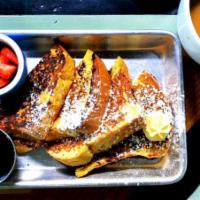 French My Toast · golden-brown french toast with whipped honey butter & maple syrup & served with fruit.