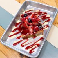Bread Pudding · House=made bread pudding topped with strawberry syrup & powdered sugar.